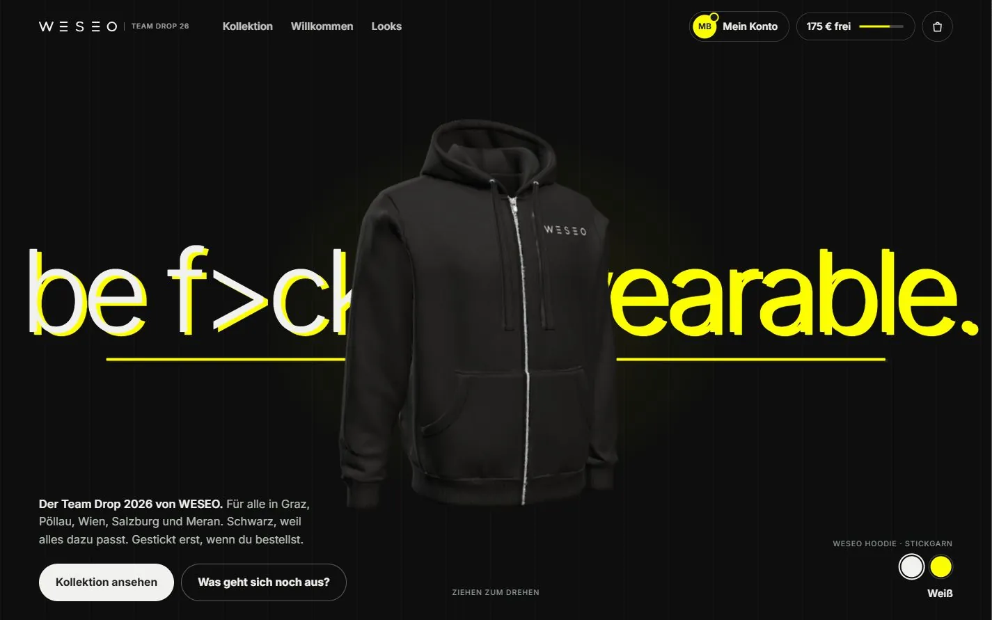 Startseite des WESEO-Shops: „be f>cking wearable.“ in Weiß und Gelb auf Schwarz, schwarzer Hoodie mit weißem Logo